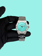 Silver/Blue turquoise dial Mansa - from ASOROCK WATCHES  a black african american owned luxury unique watch brand with swiss rolex, Audemars Piguet, patek homage inspired style watches. Also a custom vvs moissanite diamond watch maker.